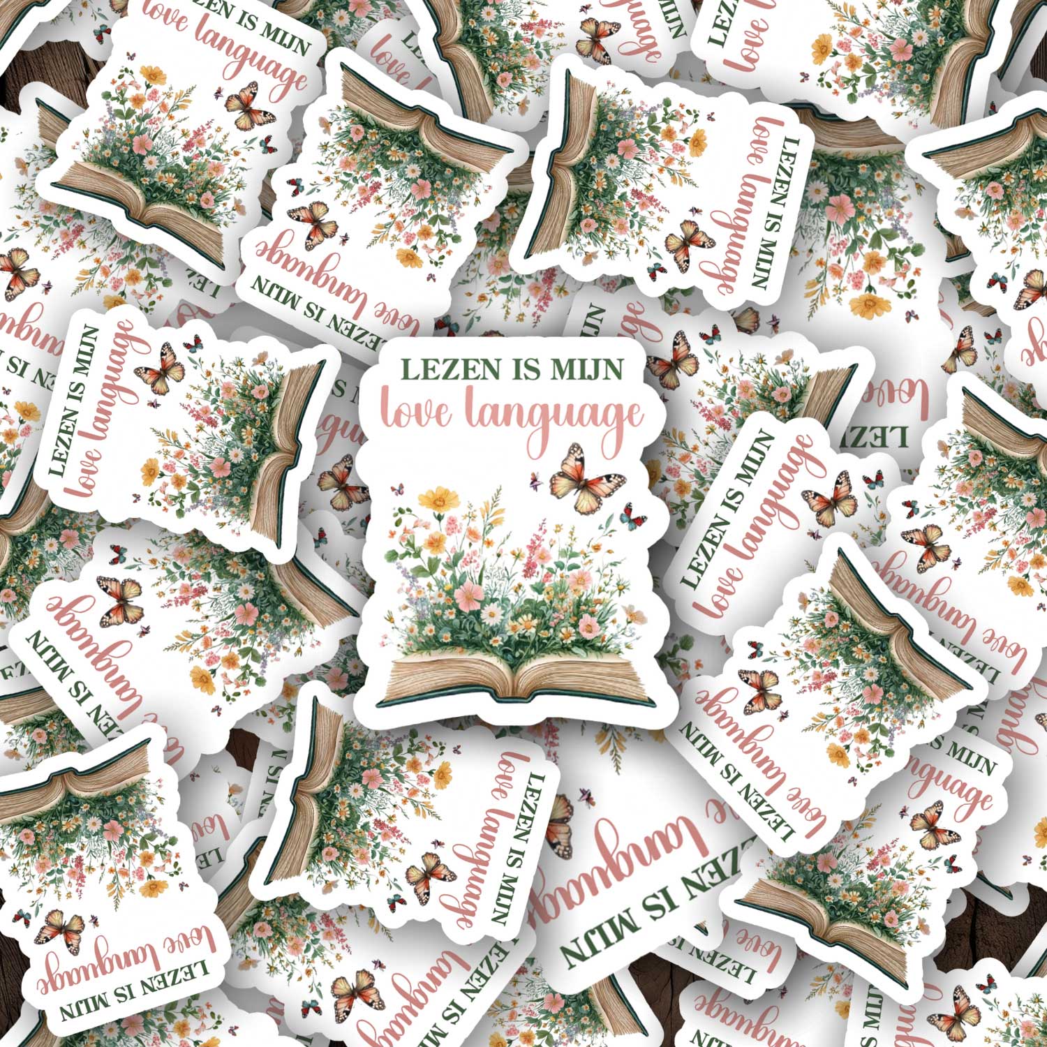 Losse stickers met de tekst Lezen is mijn love language en illustratie van open boek met bloemen en vlinders
