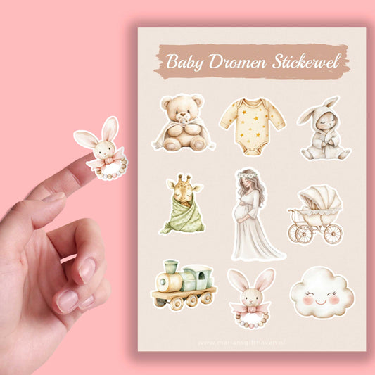 Close-up van een losse konijnensticker naast een Baby Dromen stickervel met baby- en zwangerschapsillustraties op een roze achtergrond.