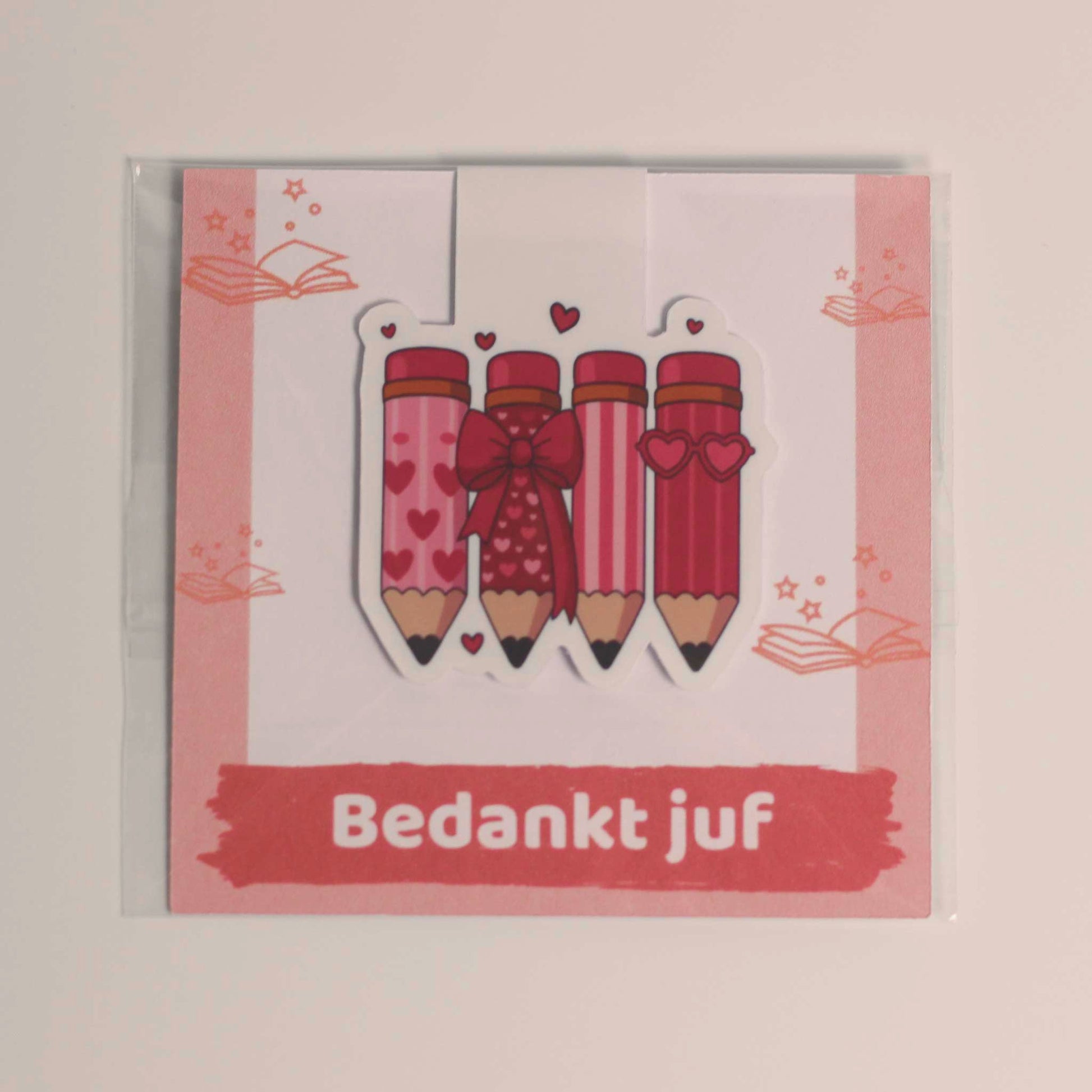 Magnetische boekenlegger voor juf in transparante verpakking op een kaartje met de tekst Bedankt juf
