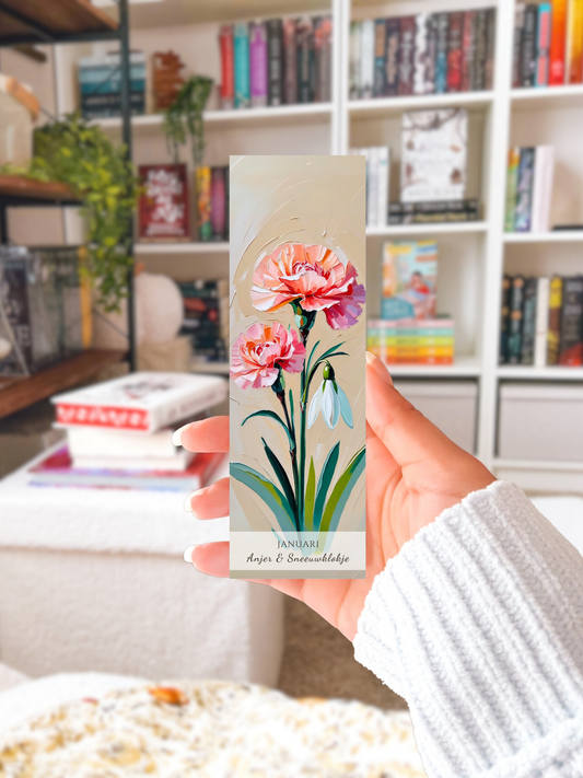 geboorte bloem boekenlegger voor de maand januari, met  kunstzinnige illustratie van anjers en een sneeuwklokje 
