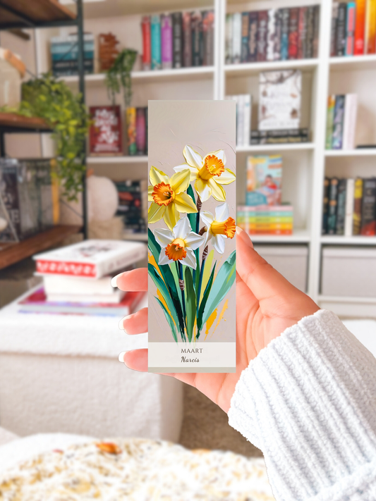 vrouw met geboorte bloem boekenlegger voor de maand maart, met  kunstzinnige illustratie van Narcissen in haar hand