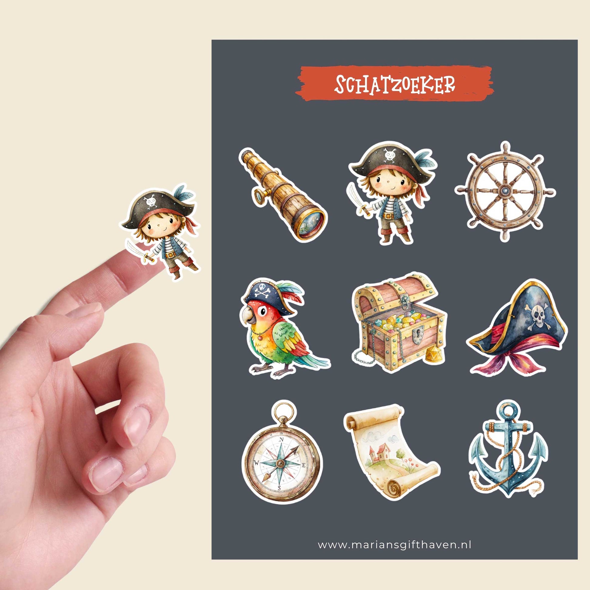 Productfoto van een stickervel met negen piratenstickers en een losse piraatsticker op een vinger tegen een lichte achtergrond.