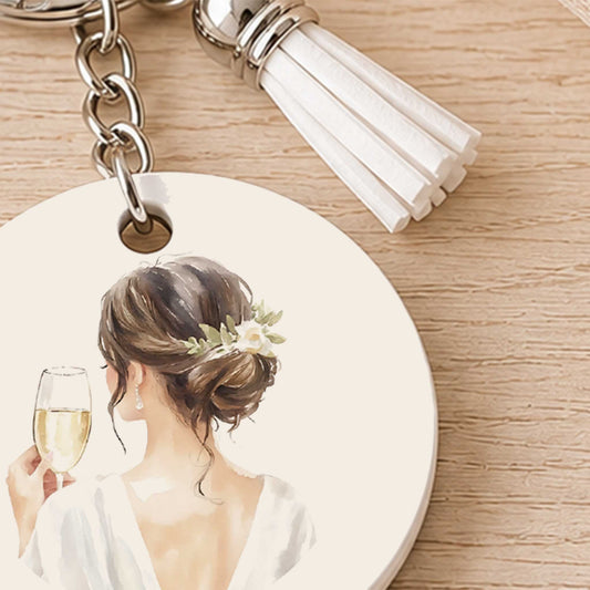 Close-up van bruid sleutelhanger met champagneglas en wit kwastje