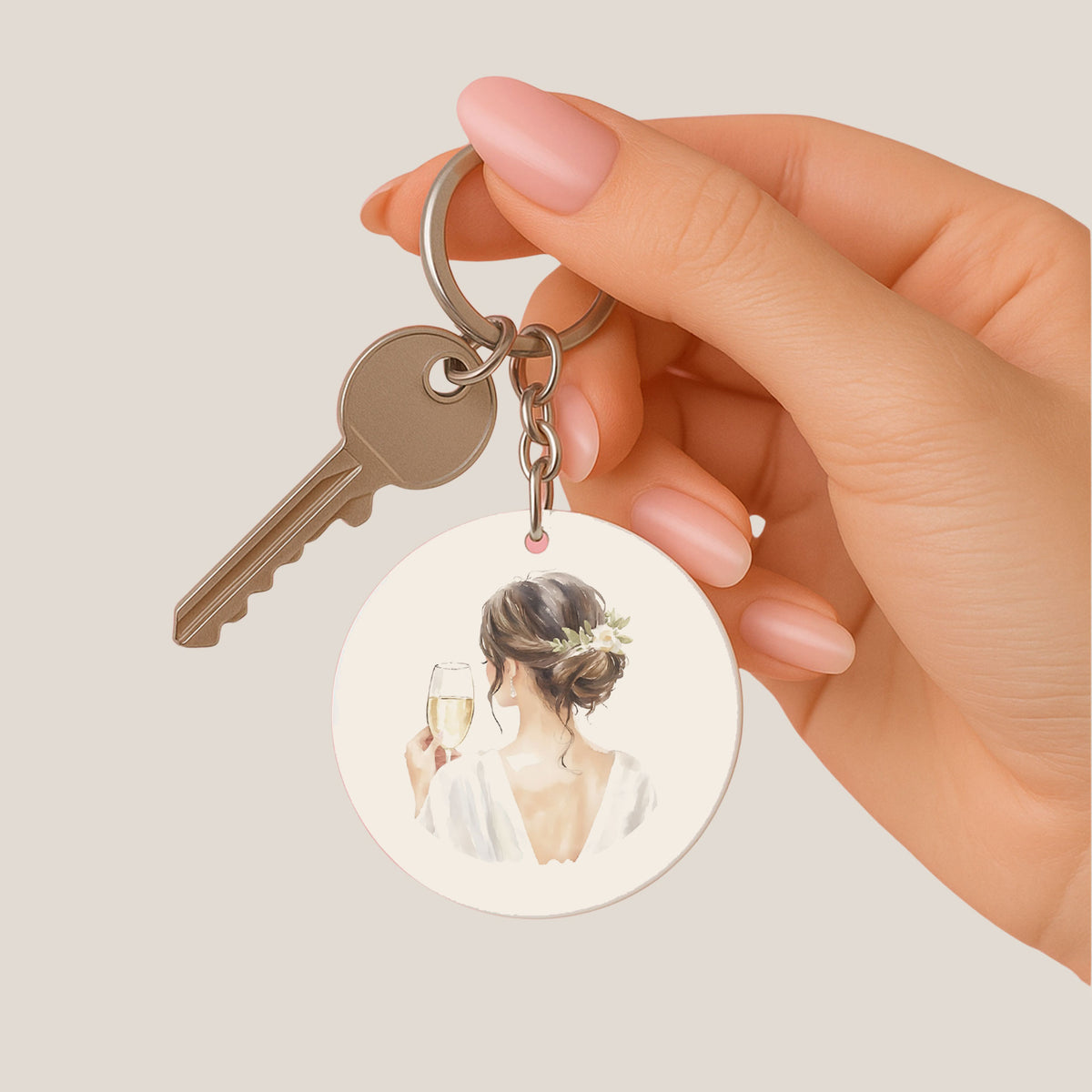 Ronde bruid sleutelhanger met champagne illustratie aan sleutelbos in hand