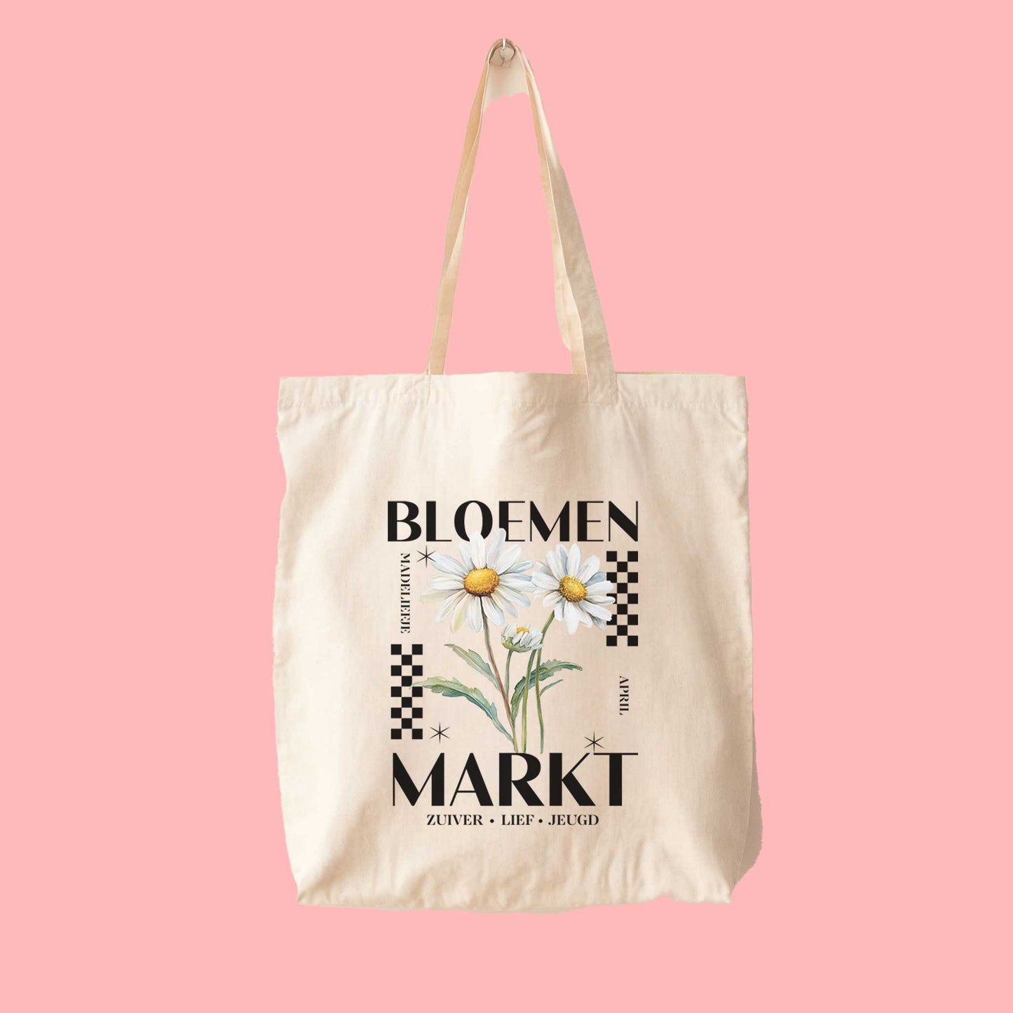 totebag met  de tekst bloemenmarkt en een illustratie van een geboortebloem van de maand april, een madeliefje. Met onderaan de kernwoorden van deze maand : zuiver,lief,jeugd