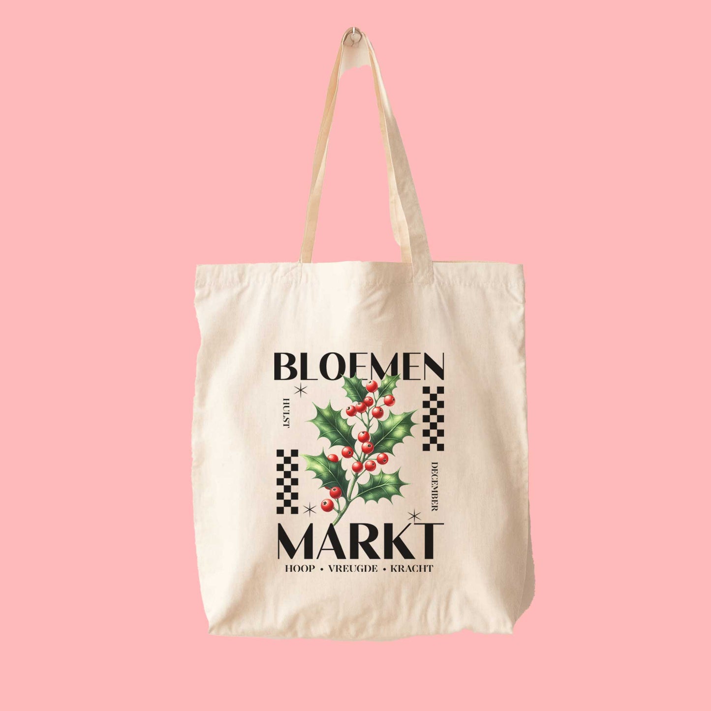 totebag met  de tekst bloemenmarkt en een illustratie van een geboortebloem van de maand december, hulst. Met onderaan de kernwoorden van deze maand : hoop, vreugde, kracht.