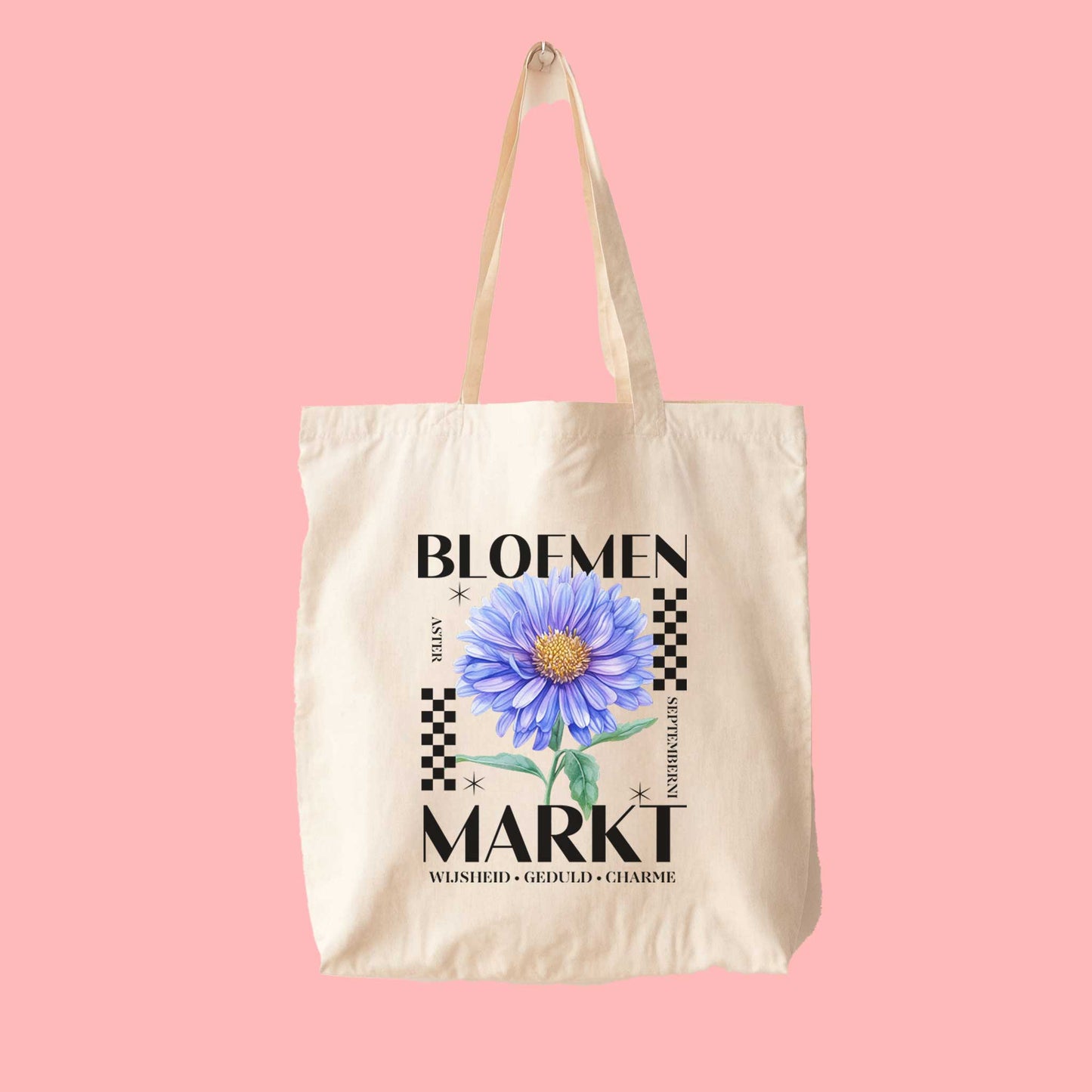 totebag met  de tekst bloemenmarkt en een illustratie van een geboortebloem van de maand september, aster. Met onderaan de kernwoorden van deze maand : wijsheid, geduld, charme.